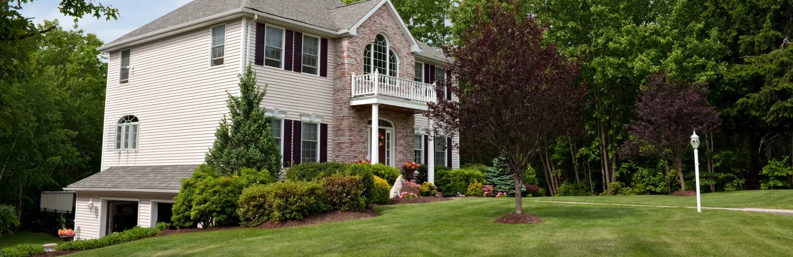 house with green lawn